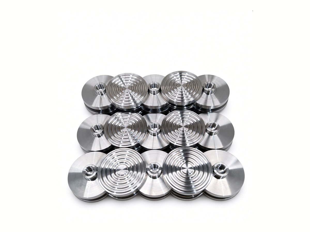 Repeat batch of CNC turned discs with grooved faces and tapped centres