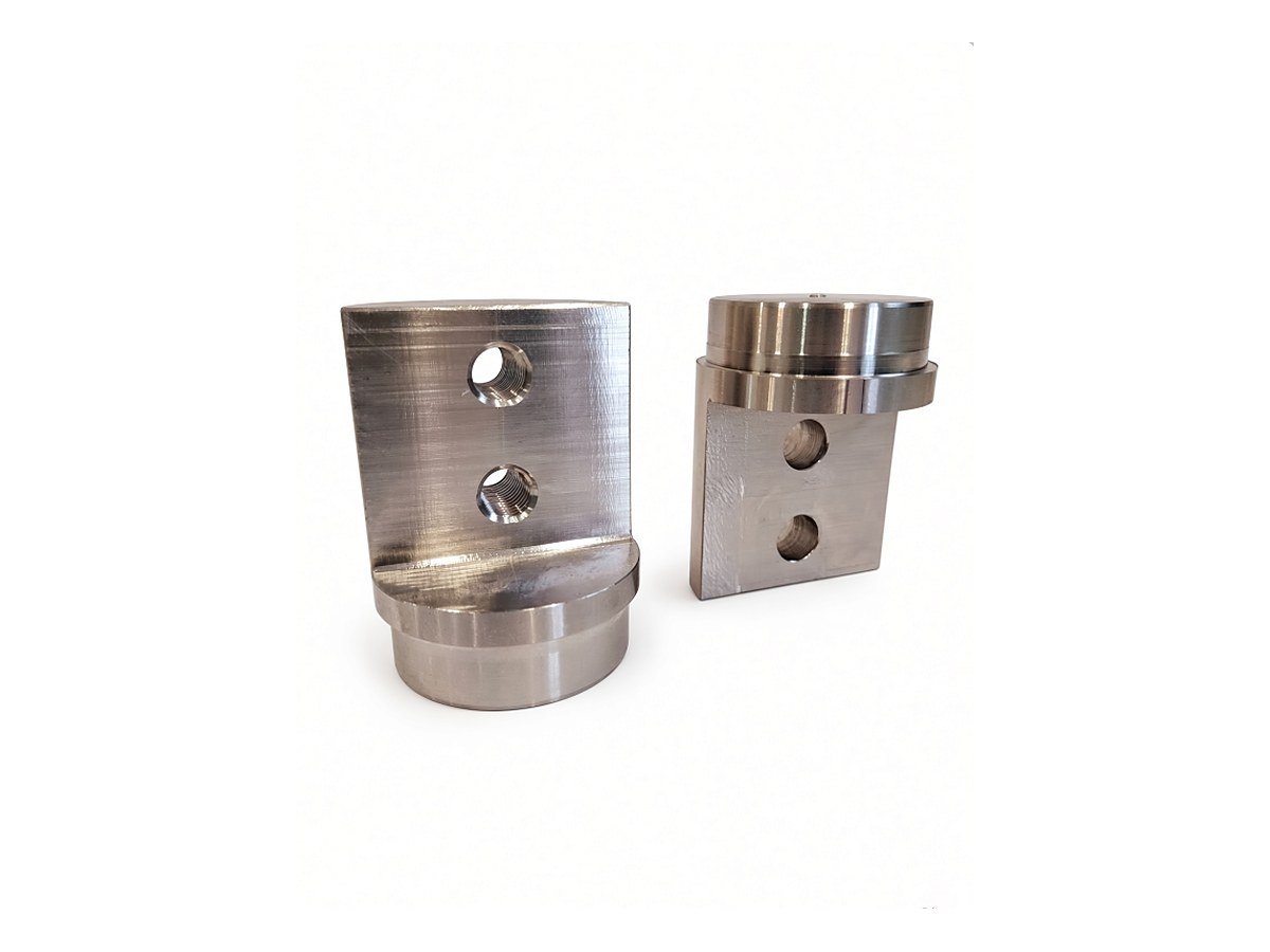 Turned and milled mounting blocks with drilled and tapped faces
